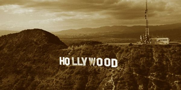 Photo of Hollywood Sign c 1991. The WGA is on strike for the first time since 2007. But what is the writers strike? And how does AI play a role?