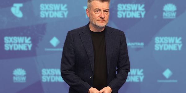 An image of charlie brooker at sxsw sydney speaking about AI